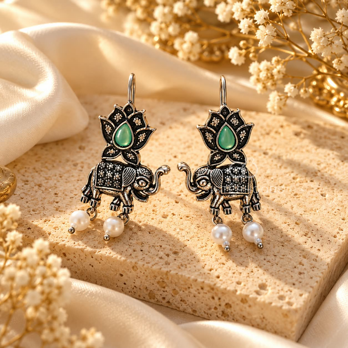 Oxidized silver tone elephant and lotus dangle earrings with green centre details and white bead drops | SISTERHOODS-SHA256:a737a278e7b88c3b7cf6e36856807f9343a1955cf08c2ccd70d2da260704a192