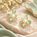 Green and white floral stud earrings with pearl centres and gold-tone outlines | SISTERHOODS-SHA256:942e4e2d3065729351322606abc7803214d484e171d45ca86335d96804b632c1