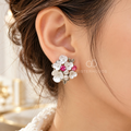 White floral cluster stud earrings with pink accents and leafy details | SISTERHOODS-SHA256:29041abfd03571a698068b5e6857060a59d6f2e5c236c65090d684ddde4558fb