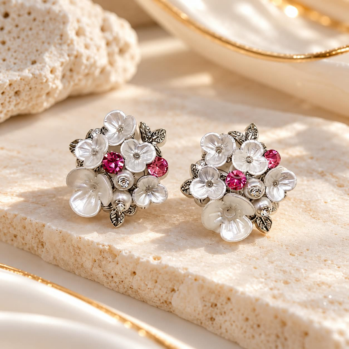 White floral cluster stud earrings with pink accents and leafy details | SISTERHOODS-SHA256:356940ea682118f961812f6ef6e16858ca580728c95b56068063a1ef27757a31