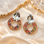 Multicolour stud earrings with clear faceted tops and vibrant circular detailing | SISTERHOODS-SHA256:304754cc7c70443d93e6bafe33446a8c9eabbd7bbc027f7c6138ba94741035a6