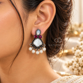 Multicolour oxidized dangle earring with pearl and red accents worn on an ear | SISTERHOODS-SHA256:25e667fe054997c3fd97f2c4310eba4d96456e7764453ee84fe964294fe76db0