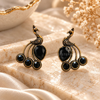 Black and gold peacock-inspired oxidized dangle earring with circular accents | SISTERHOODS-SHA256:d38d0b19be51b0017312755fc74fc64e179a61907b29cea8fb258bc31ef6cde6