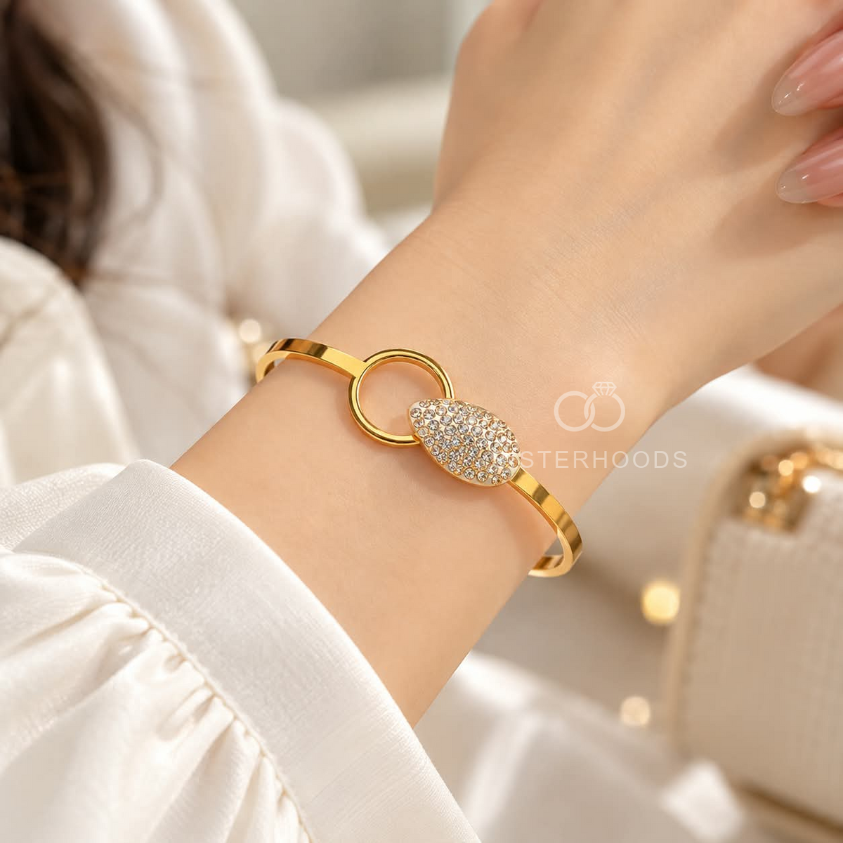 Gold-tone bracelet with crystal-studded oval centre and circular accent | SISTERHOODS-SHA256:ad2d5df507b5c1eb98f1884bd1043188f4d29f9e3ae4d9295c37b5364a3a74b1