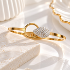 Gold-tone bracelet with crystal-studded oval centre and circular accent | SISTERHOODS-SHA256:7e368d7eac6bf81731a5105088f418e7240ee9bb269a086507a454df0d28c438