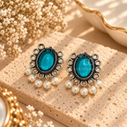 Teal oval oxidized dangle earrings with ornate detailing and white pearl fringe accents | SISTERHOODS-SHA256:d47a20d08f10812d17275b2ea27c8bbd3a5ef24255c89ac69f5d55155249007a
