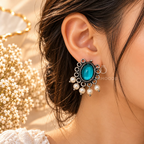 Teal oval oxidized dangle earrings with ornate detailing and white pearl fringe accents | SISTERHOODS-SHA256:e91884cc41c6e7a9be733960e098a9467633404c21ab9576693b5b864a4c2eb1
