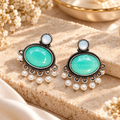 Turquoise oval dangle earrings with white bead fringe and dark oxidized-style detailing | SISTERHOODS-SHA256:0b4a3263aa798433d5e74efa0d14775ef18382b1c364e8d02336209d4b967199