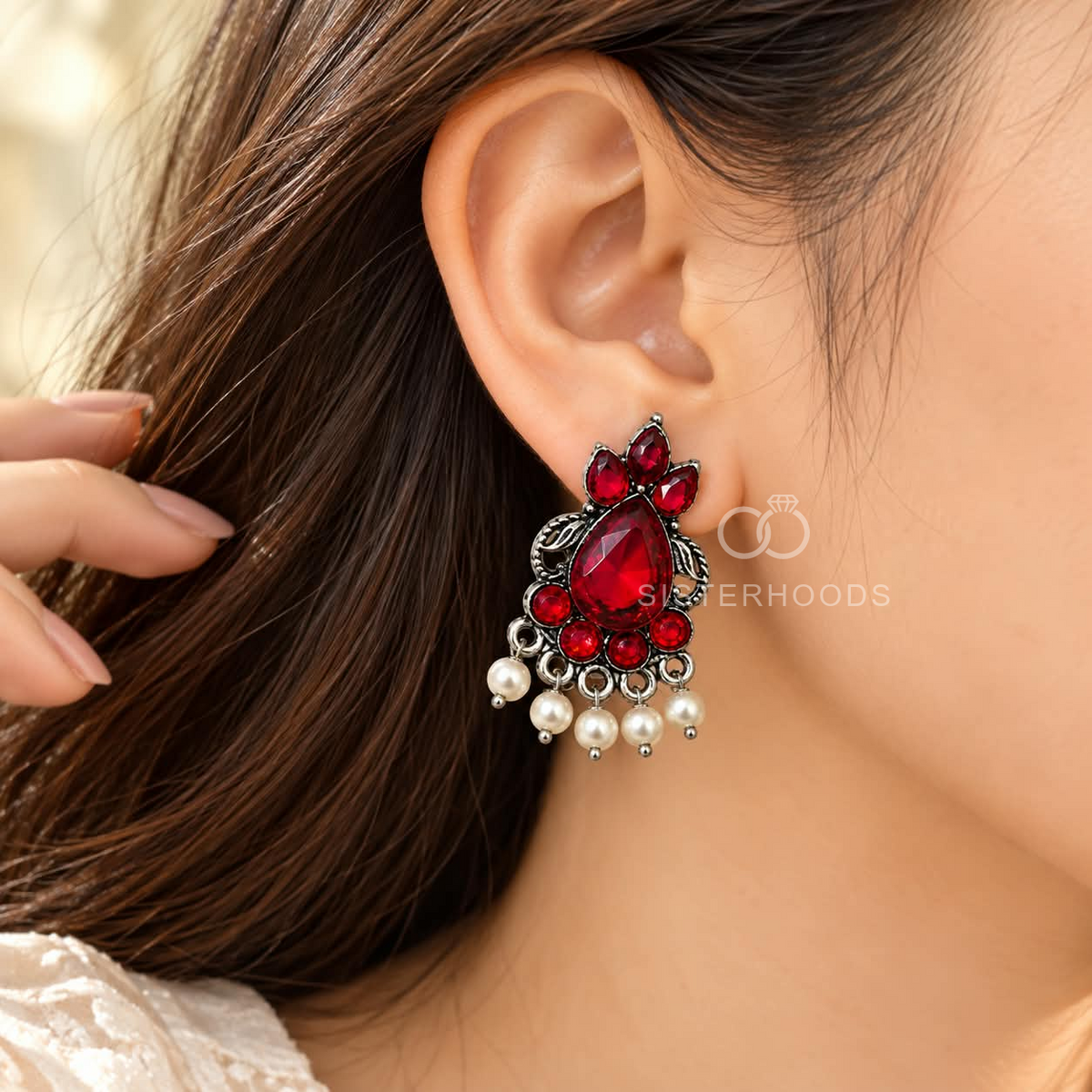 Red oxidized dangle earrings with leaf details and cascading white pearl-style drops | SISTERHOODS-SHA256:32cbfce40e097ef6061536b070192a304754ade5b3081809e4f336a6d5516f0b
