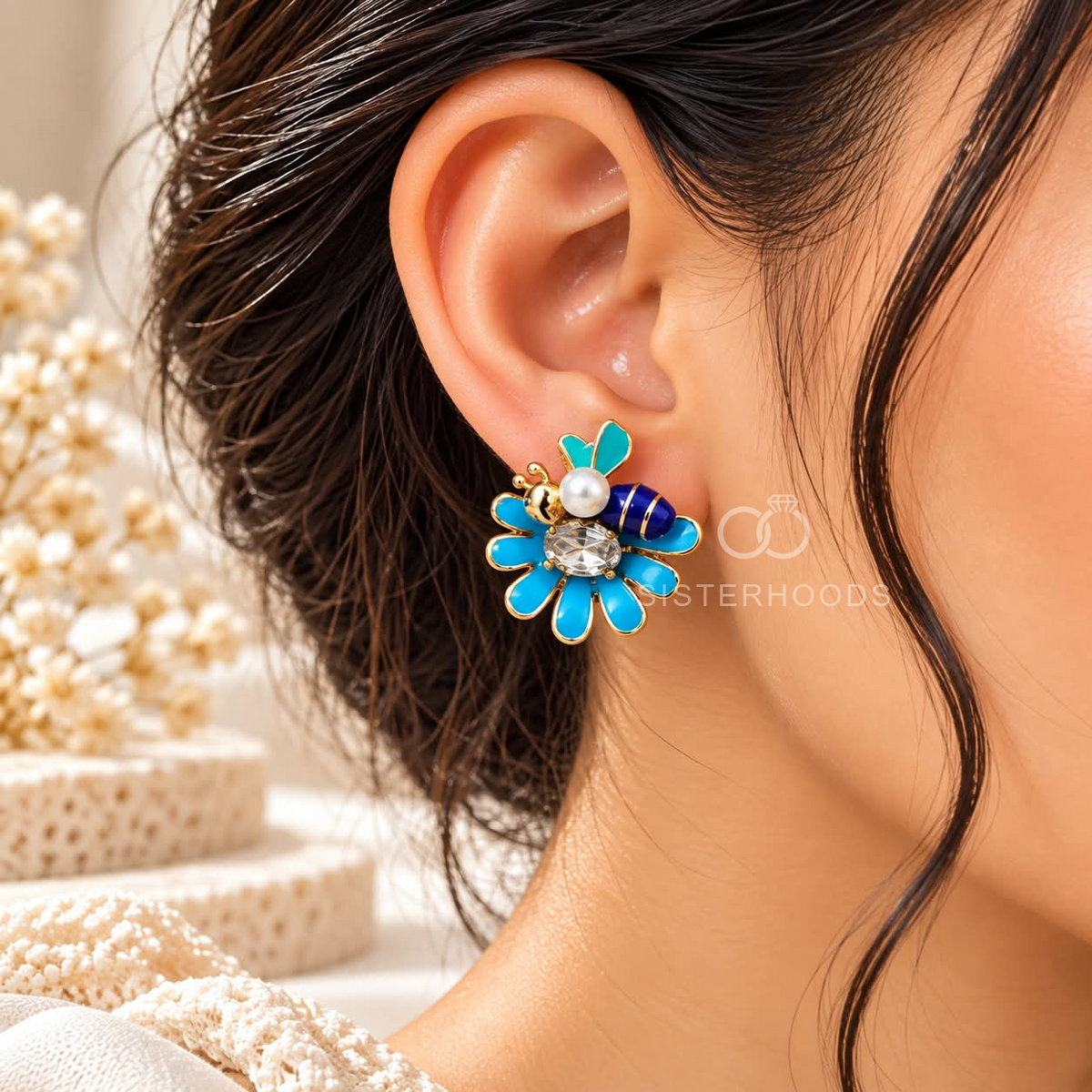 Blue floral stud earring with pearl and faceted centre detail | SISTERHOODS-SHA256:30da3e57b5d64eb7b2918f2d64f73a79653185f7408b619f8781057b3216f378