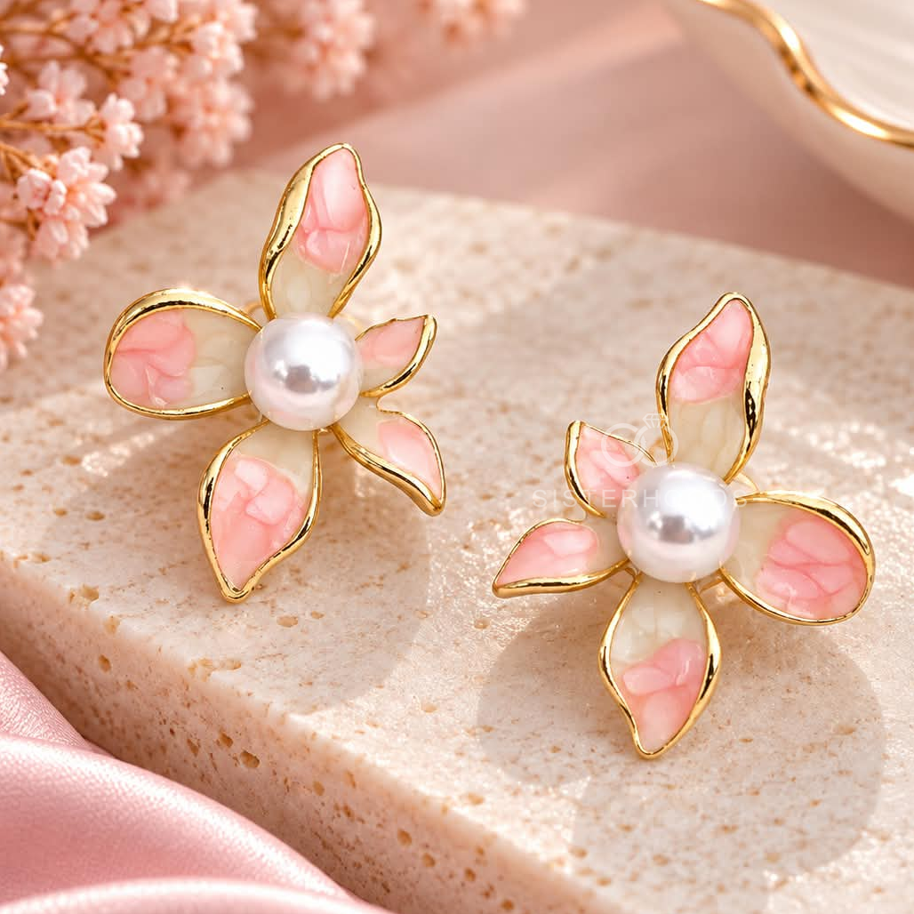 Pink flower-shaped stud earrings with pearl-style centres and gold-tone outlines | SISTERHOODS-SHA256:bcd790334b54c3b51473e78feff12aa7754656522594d3005d0bd3dc3d617fa1
