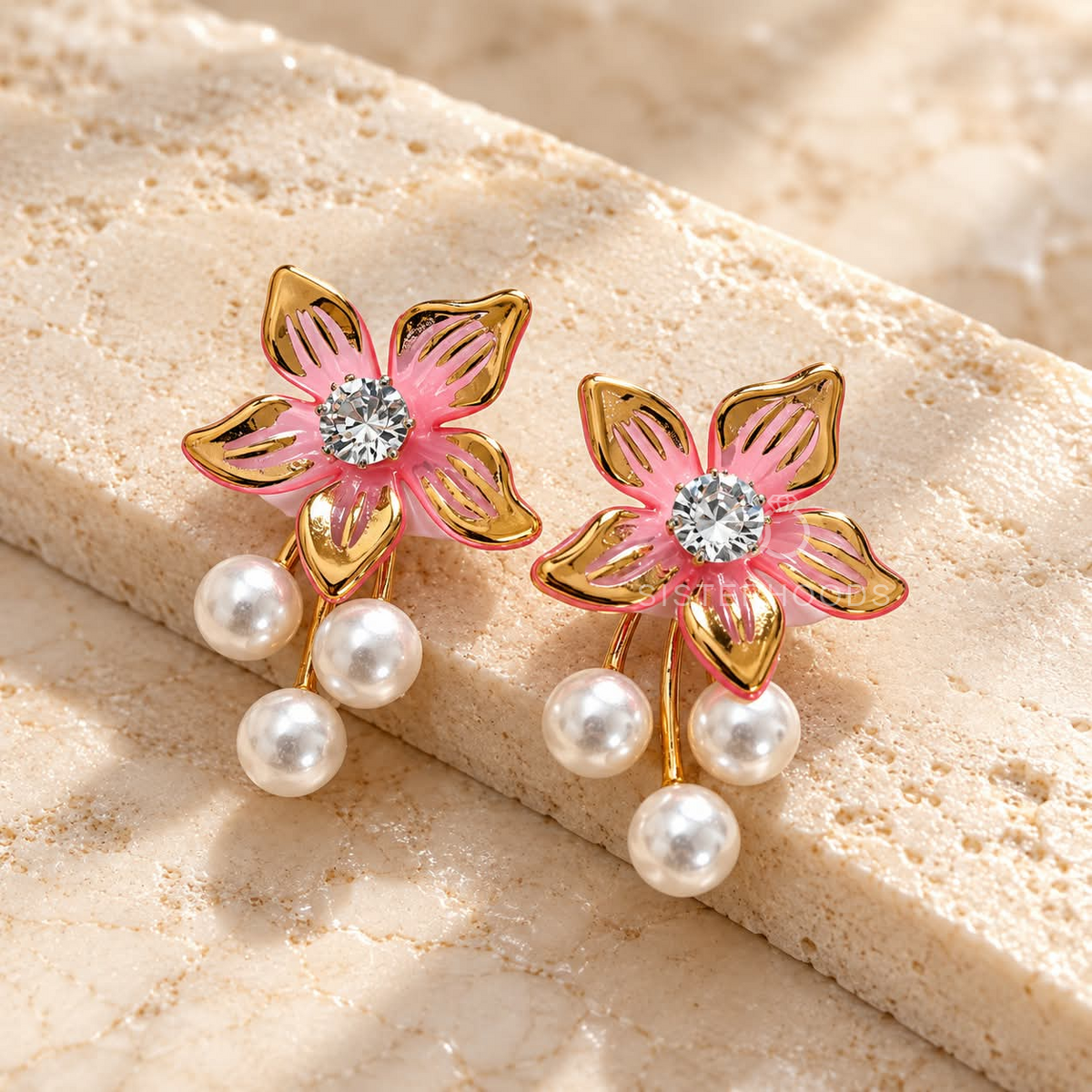 Pink floral dangle earrings with sparkling centres and three white pearl drops | SISTERHOODS-SHA256:627ec15afbd324c8a292d1323d60784f373b67b487e84559a8e37cb43e9997f3