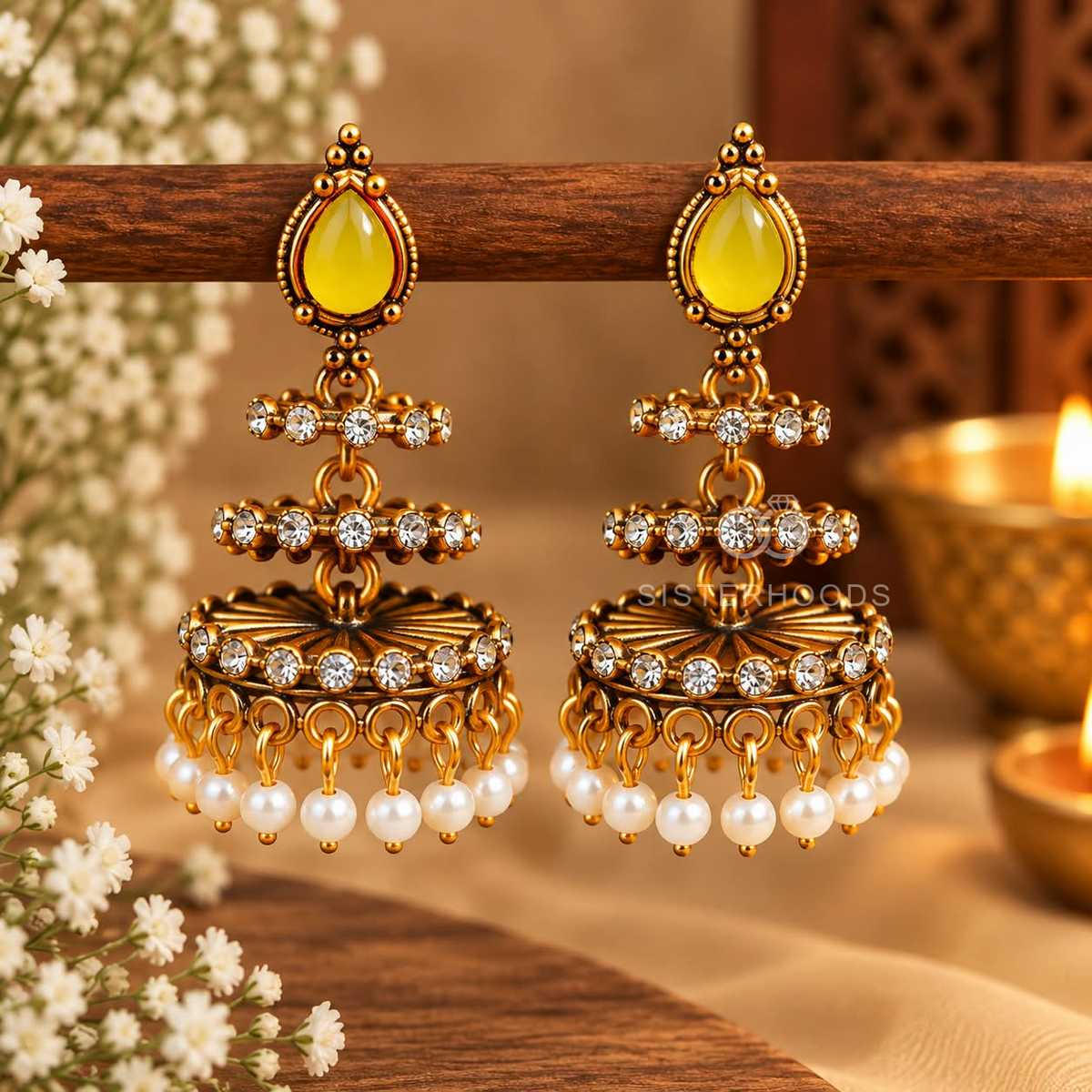 Ornate gold-tone jhumka earrings with yellow teardrop accents, clear details and white bead fringe | SISTERHOODS-SHA256:5f7983245759f38e46d3e8f9ce125e18951c093b09a44e571849b06cfdb284bd