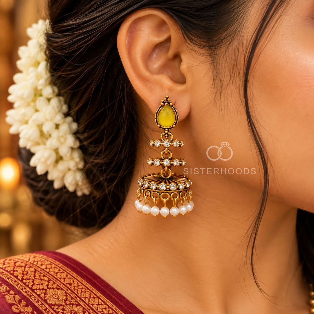 Ornate gold-tone jhumka earrings with yellow teardrop accents, clear details and white bead fringe | SISTERHOODS-SHA256:cdbcbf92fdac52458667130059b5607e73a25e1cabaeaf8029e85299179989f6