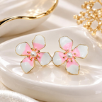 Pink and white flower stud earrings with pearl-like centres and gold-tone detailing | SISTERHOODS-SHA256:0e4fa1e47d7c2d3966af231de51d7c7ae86affbce21f657977e3d39996a4ade8