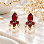 Gold-tone dangle earrings with red faceted accents and white bead drops | SISTERHOODS-SHA256:3827b394eadf31b5e14a0842ffc2dae239af2642b9c8bcd85efa4b2a6e17f0a9