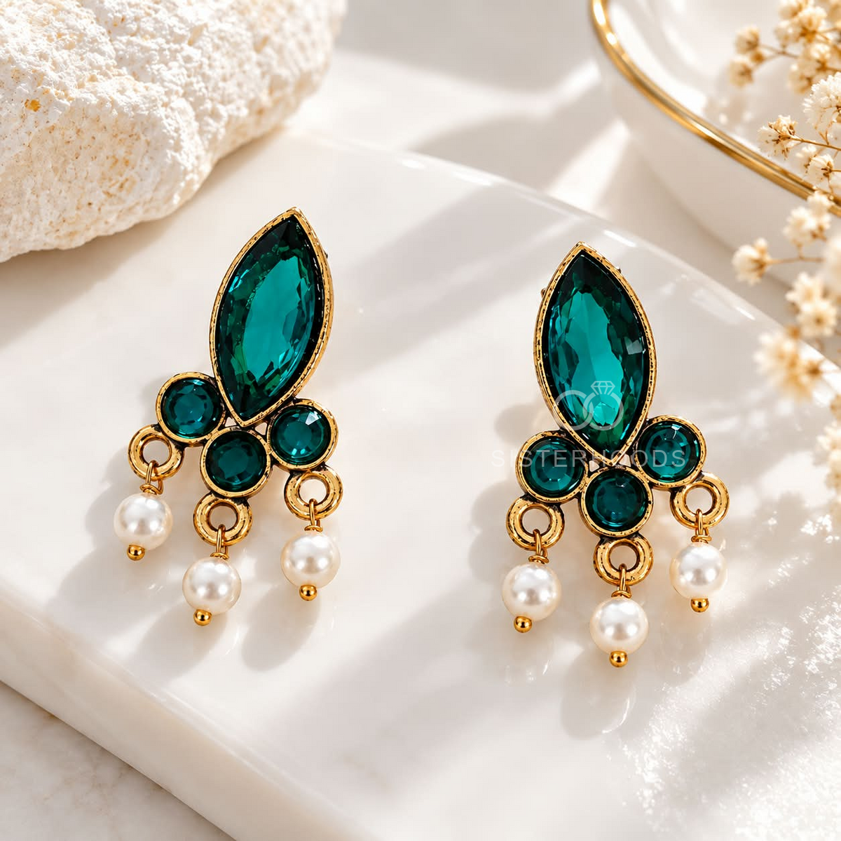 Green leaf-shaped pearl dangle earrings with circular accents | SISTERHOODS-SHA256:6b7d665a5c391523191e1258ef6b1a8dbb23360bb8491d2626c52f65198c4d6f