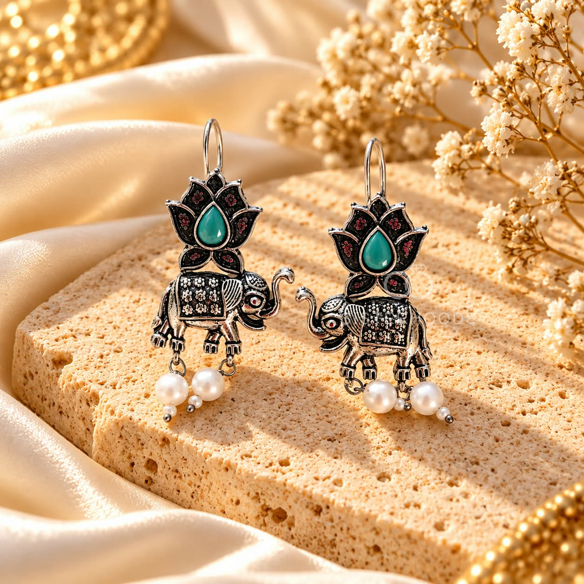 Oxidized silver-tone elephant and lotus dangle earrings with green centre detail and white pearl drops | SISTERHOODS-SHA256:b0aade4d0778c900f433162835a77ba8d2de384b36704554f4877f18db89fadf