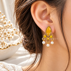 Gold-tone dangle earring with yellow marquise accents and white pearl drops | SISTERHOODS-SHA256:5f3fd1bd2a1eeb667dc4fbae01e9c40e728b1dd10126b60be99159505df1aba0