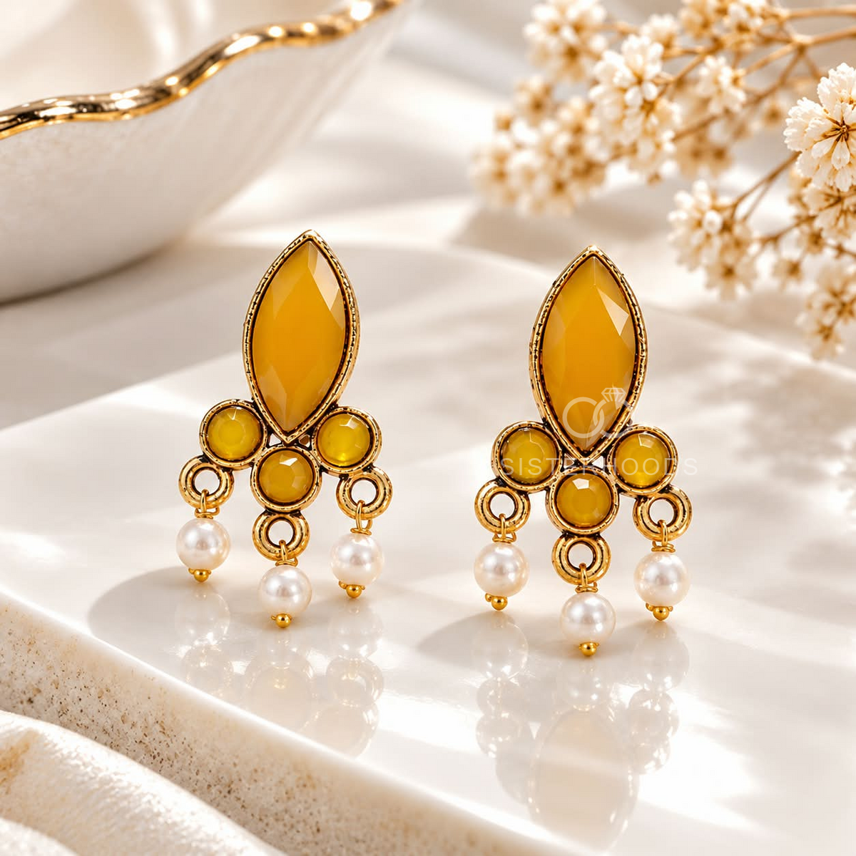 Gold-tone dangle earring with yellow marquise accents and white pearl drops | SISTERHOODS-SHA256:8ae00881f228a20fcd59efa890c5fb487637febcd2b430930bc4a13cd682a3c9