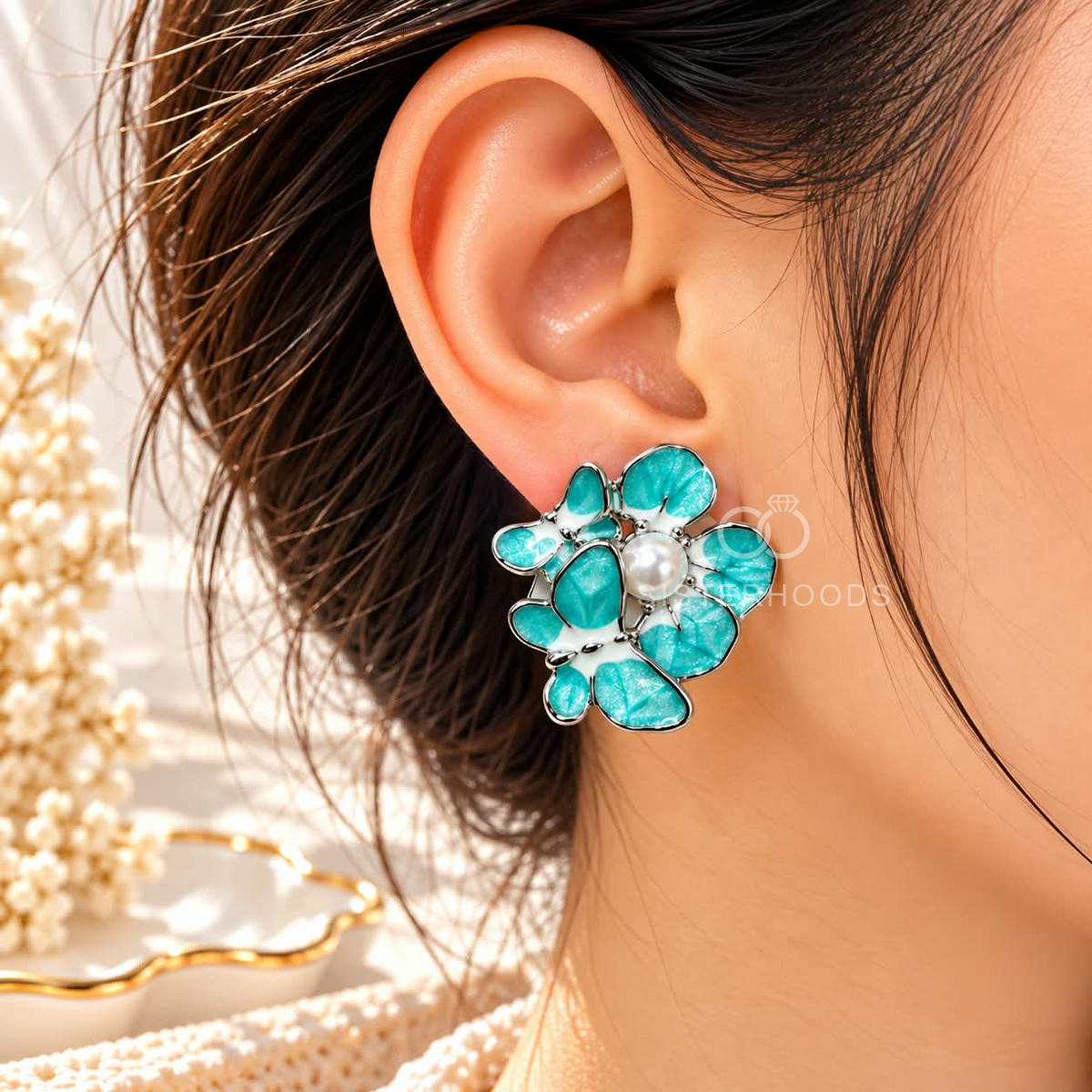 Turquoise floral stud earrings with white pearl centres and silver-tone outlines | SISTERHOODS-SHA256:5231705b33ea5e46fdde105a07af6e7c5baff7d524f21b7bf62907b86fad69fc