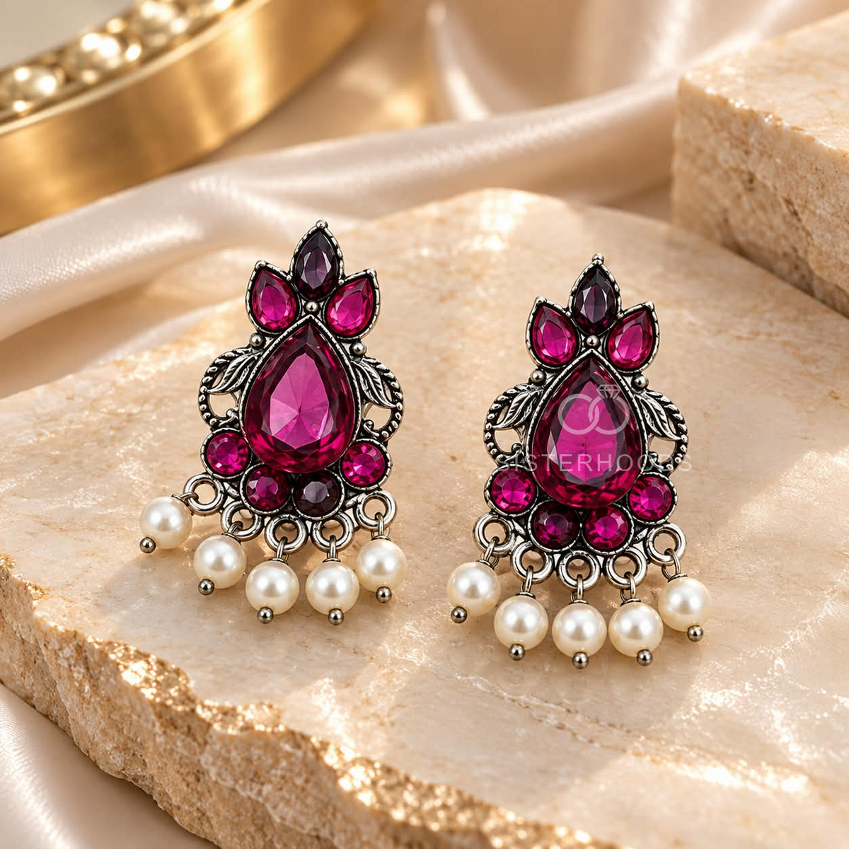 Ornate oxidized dangle earrings with pink accents and pearl drops | SISTERHOODS-SHA256:cc8dd68adc18a1a3fc086c914eb77635e22ac8abe8e2801a781fdd3aefa83a45