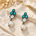 Oxidized dangle earrings with teal accents, geometric square details and white pearl drops | SISTERHOODS-SHA256:7955eb4199706a76c897d9dea5cfb212c013803d2ccc6dac26680190b7ffd775