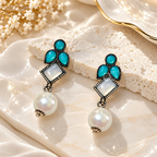 Oxidized dangle earrings with teal accents, geometric square details and white pearl drops | SISTERHOODS-SHA256:7955eb4199706a76c897d9dea5cfb212c013803d2ccc6dac26680190b7ffd775