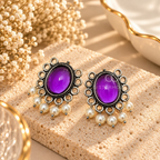 Oxidized silver-tone dangle earring with a violet centre and pearl drops | SISTERHOODS-SHA256:7a9ce635a69bf66ea31766543dcf94e8ce14e710089a1fceb91cf72b2a6fd32b