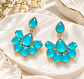 Turquoise faceted floral dangle earrings with petal-shaped drops and gold-tone detailing | SISTERHOODS-SHA256:cc4911ae14149e9760aa0fcbe4bf9325a182f4f35489f4b43628ab18df794e37