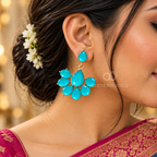 Turquoise faceted floral dangle earrings with petal-shaped drops and gold-tone detailing | SISTERHOODS-SHA256:68b23a742dc0982665c1241892726b05df8a3bfe8f321068035e63c17d3d36af