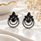 Black stone oxidized dangle earrings with petal accents and circular detailing | SISTERHOODS-SHA256:a96f06a324f0969ab6b981fafd648c11cafb712cea9a1a1f937a3934d49bdca4