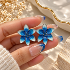 Blue and white floral stud earrings with gradient petals | SISTERHOODS-SHA256:989498cb255d615ec1f2c4215f83059a6c9180155a67d74f3c25b7f1d489c13b