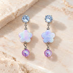 Multicolour flower dangle earring with faceted silver, iridescent and purple accents | SISTERHOODS-SHA256:14651dade7a7ab6ad06c7c3806f947d5833a0bef6a92cb0c9128c891cdc9a5ba