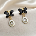 Black floral cluster dangle earrings with white oval accents | SISTERHOODS-SHA256:adc1de899260160c167246b00e18939020af39b74205b3c4d30eba6c2be15d00