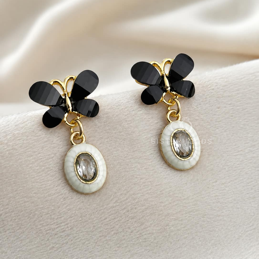 Black floral cluster dangle earrings with white oval accents | SISTERHOODS-SHA256:adc1de899260160c167246b00e18939020af39b74205b3c4d30eba6c2be15d00
