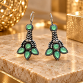 Green floral oxidized dangle earrings with round and petal-shaped accents | SISTERHOODS-SHA256:e810a9801f0bb0ac210a45e864a0ca95e15f863cfa5505ee90dd335ad7191e34