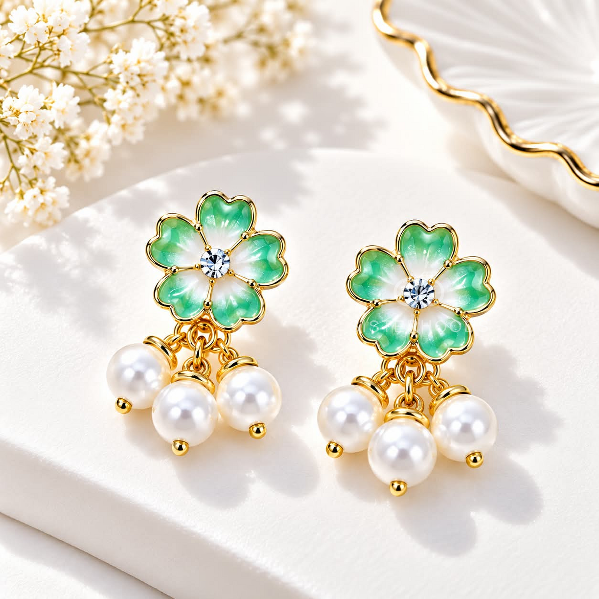 Green floral earrings with white pearl cluster dangles and gold-tone accents | SISTERHOODS-SHA256:74b964864c842585058d308a2db12aa98d9ca3290d8c205d0f1c887d668c431b