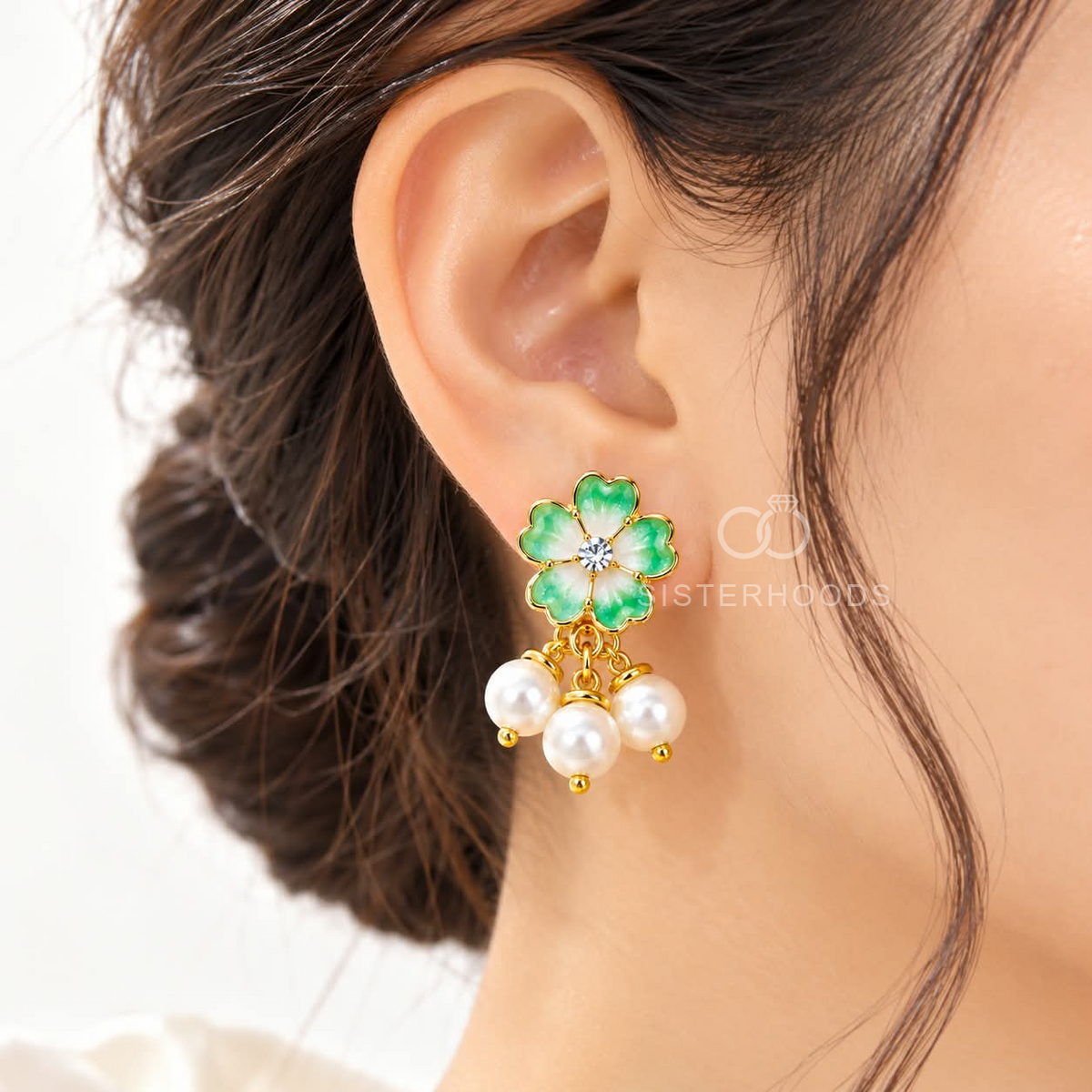 Green floral earrings with white pearl cluster dangles and gold-tone accents | SISTERHOODS-SHA256:7af44666ff30d01f2c9e17a585e3ad8be9cd9f52d6216e91436210353cb50daf