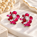 Pink floral stud earring with a central white pearl and silver-tone detailing | SISTERHOODS-SHA256:fee33e952bb33510da797585d45deaa5cfd2c83864ef58c529b46c91dbecd241