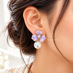 Pastel purple floral drop earrings with pearl accents and faceted centres | SISTERHOODS-SHA256:e9a5f11e1e7f438350fe9008a2676f0fa6b41b1015b58361d5fda44a657eb432