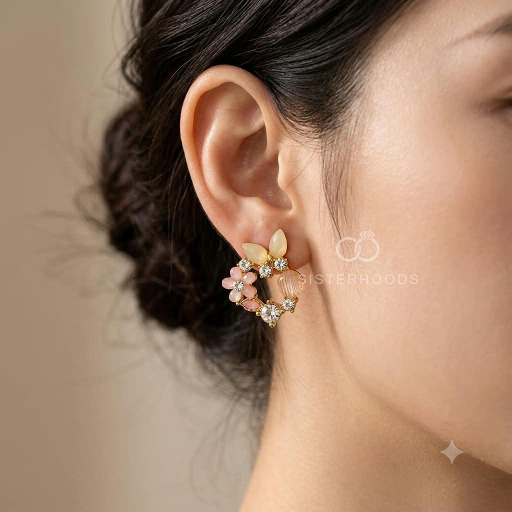 Floral stud earring with blush pink, cream and gold-tone petal details | SISTERHOODS-SHA256:3d1b7f81a1c0d8c74e33758283a8bc496e41074868f4a91cb6a65e833b2f88db