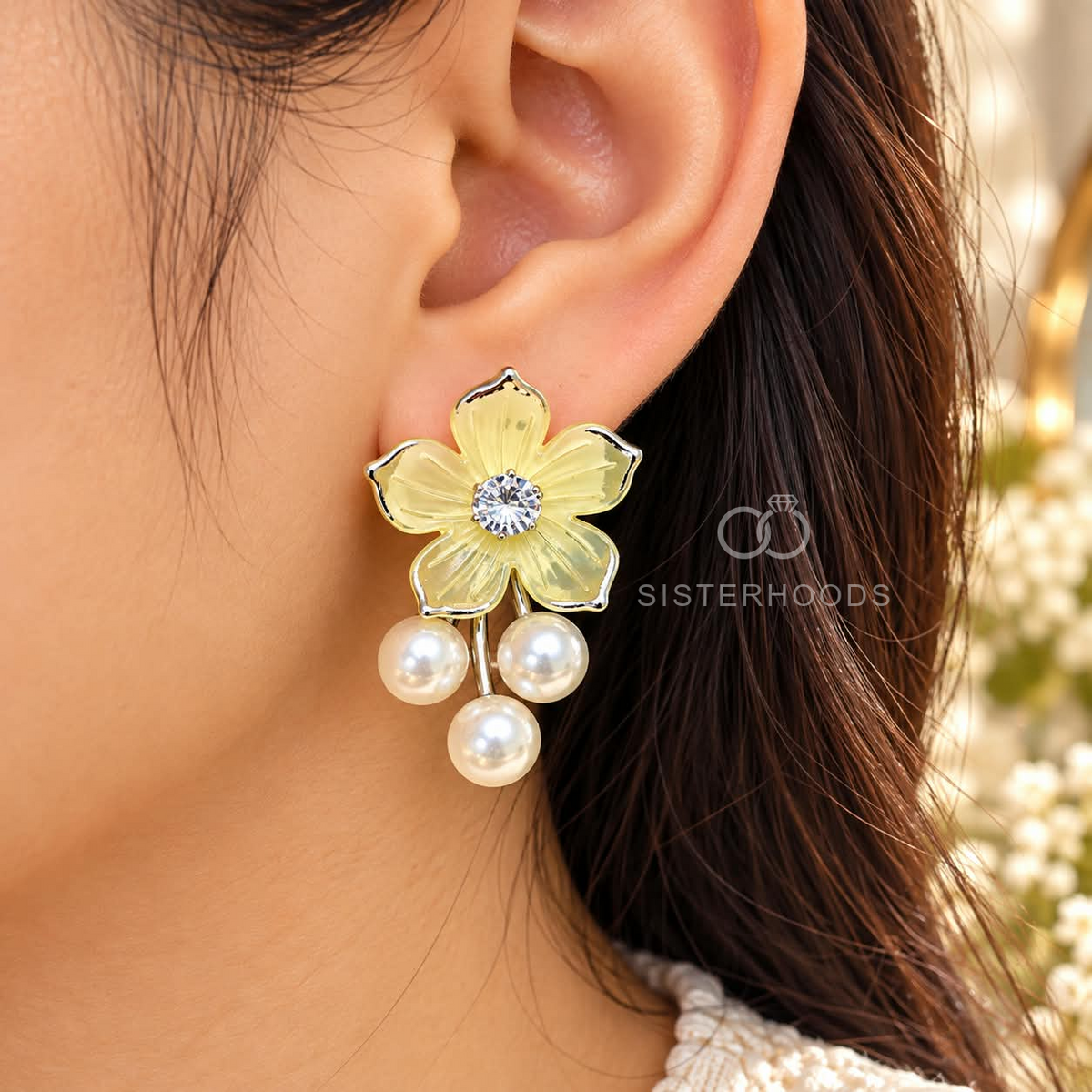 Golden floral dangle earrings with a clear centre stone and three white pearl drops | SISTERHOODS-SHA256:6c84cf33dc1e4115cfc7b9eb5d0b5a5227e365862a7440629b4ba7ca3458dd38