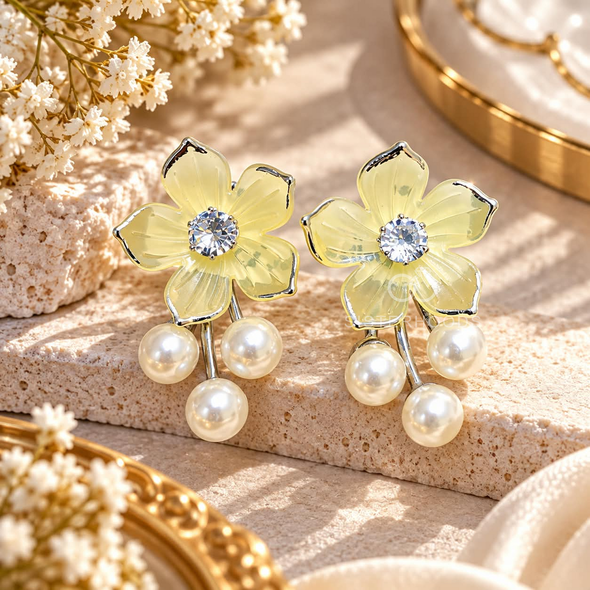 Golden floral dangle earrings with a clear centre stone and three white pearl drops | SISTERHOODS-SHA256:80908cb50fdf04abb013b292aa16b4496ebcf0320787f06f1b3eadfb398fb41c