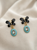 Black floral drop earrings with turquoise oval pendants and clear centres | SISTERHOODS-SHA256:e5e7a15a2bc239f6a8feb0c2bcb3505356b9717a49e86e43da35464b16010ec3