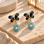 Black floral drop earrings with turquoise oval pendants and clear centres | SISTERHOODS-SHA256:c8b913249057a120647a40cff68277e536fc8fb23f8ac5e424cd06ed1c3e761c