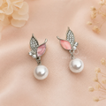 Pink butterfly drop earrings with silver-toned detailing and round white hanging beads | SISTERHOODS-SHA256:2622c1aba98593e7dca52465644f967a9376f62a390746620c2086244928dcfd
