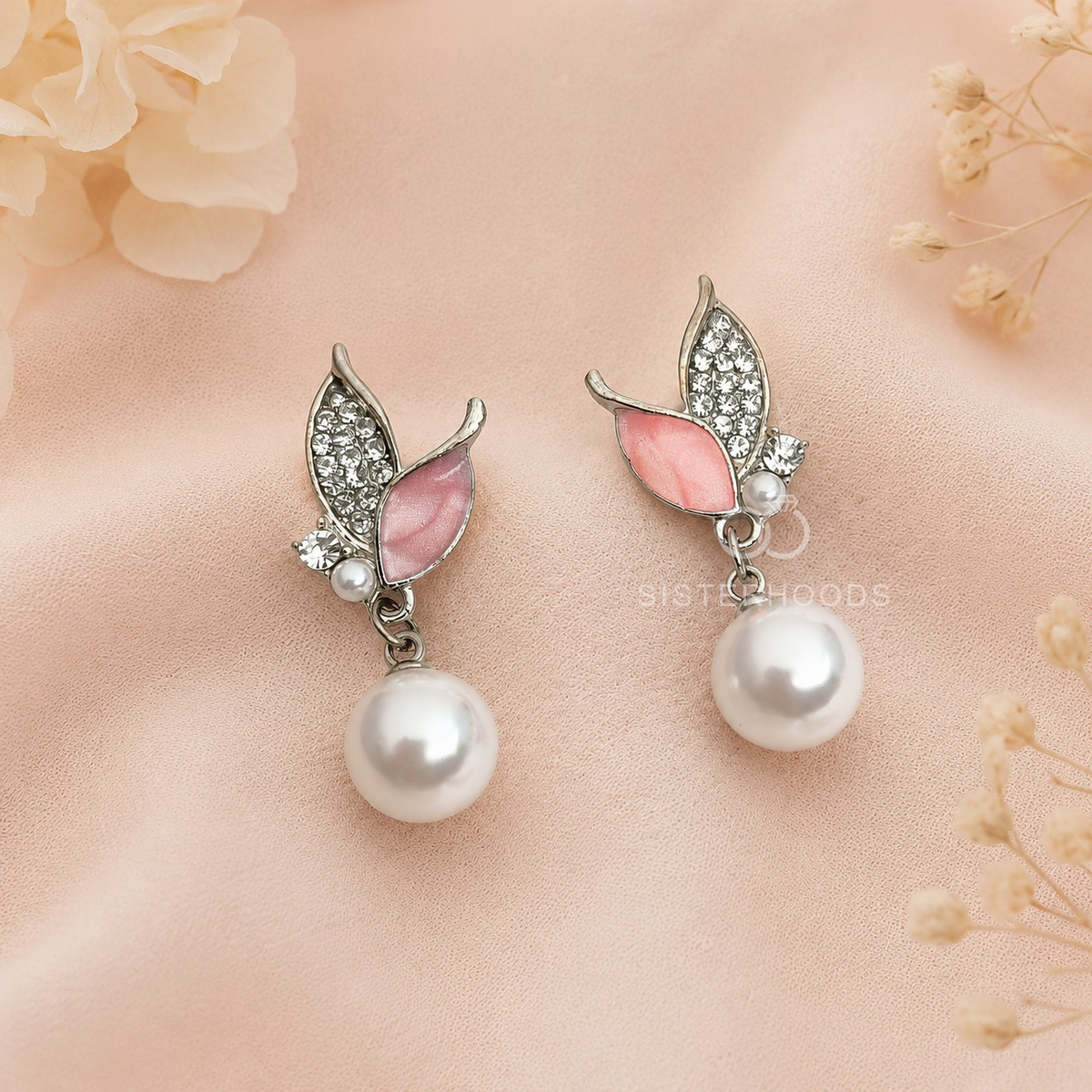 Pink butterfly drop earrings with silver-toned detailing and round white hanging beads | SISTERHOODS-SHA256:2622c1aba98593e7dca52465644f967a9376f62a390746620c2086244928dcfd