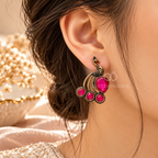 Peacock-inspired oxidized dangle earring with pink accents and curved gold-tone details | SISTERHOODS-SHA256:49a86ac69259a206ff39fc6abe25e4a77c8b1a8124454cf615635ad63df3fde1