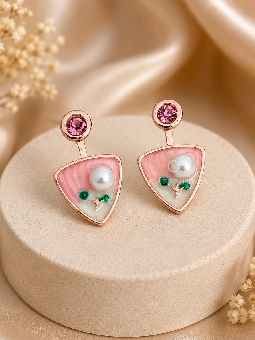 Pink triangular dangle earrings with white bead and green floral accents | SISTERHOODS-SHA256:5294cc37d71ced12b8e07008862242429a23f0a2c0381513a7e4f2594433c76f